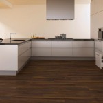 Dark Brown Flooring Awesome Dark Brown Wood Laminate Flooring In Modern Kitchen Furnished With White Sectional Kitchen Cabinets Completed By Sink And Range Plus Countertop Interior Design Wood Laminate Flooring Design In Home Interior