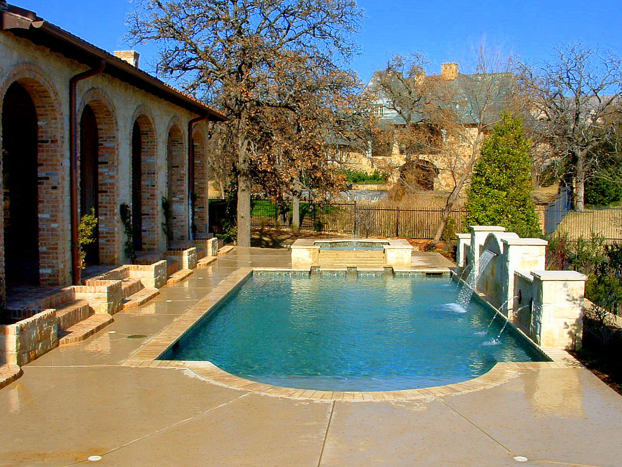 Pool Design Mediterranian Backyard Pool Design Of A Mediterranean House With Beige Marble Floor Near Side Hot Tube And Trees Backyard Appealing Backyard Pool Designs For Contemporary Residences