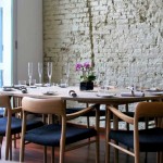 Scandinavian Themed Ideas Beauteous Scandinavian Themed Dining Room Ideas For Party With Rustic White Rough Brick Wall Exposed Ideas And Classic Round Dark Wooden Dining Table Design Also Modern Black Sleek Chairs Dining Room The Best Simple Dining Room Ideas