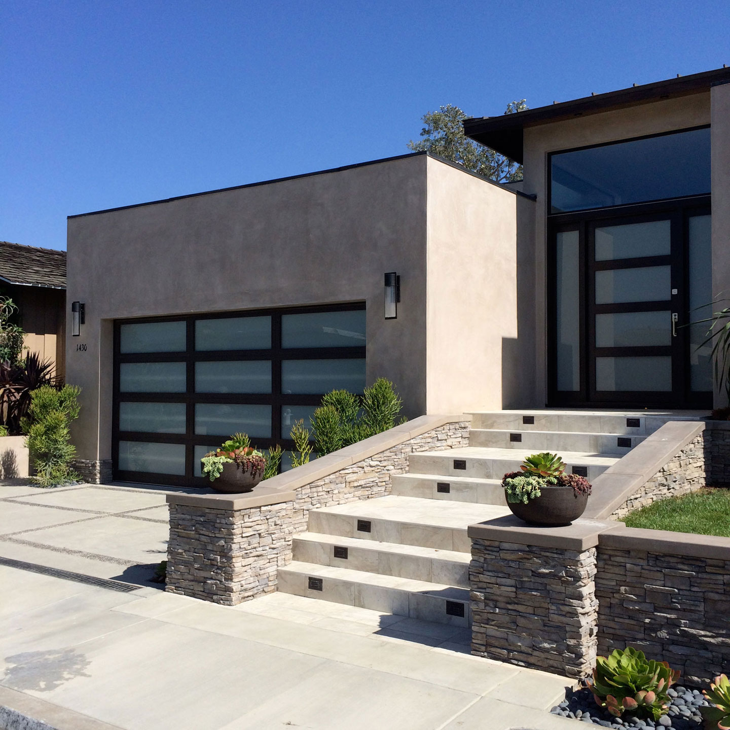 Modern Garage Using Beautiful Modern Garage Doors Design Using Glass Material Combined With Wooden Frame Decoration And Outdoor Staircase Ideas With Stone And Concrete Material Decoration Fascinating Modern Garage Doors Used In Remarkable Designs
