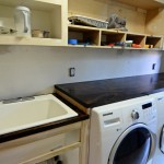 Marble Countertop Laundry Black Marble Countertop Feat Stylish Laundry Room Sink And Multi Purposes Hanging Wall Open Shelf Idea Interior Design  Laundry Room Sinks That Are Functional As Well As Decorative 