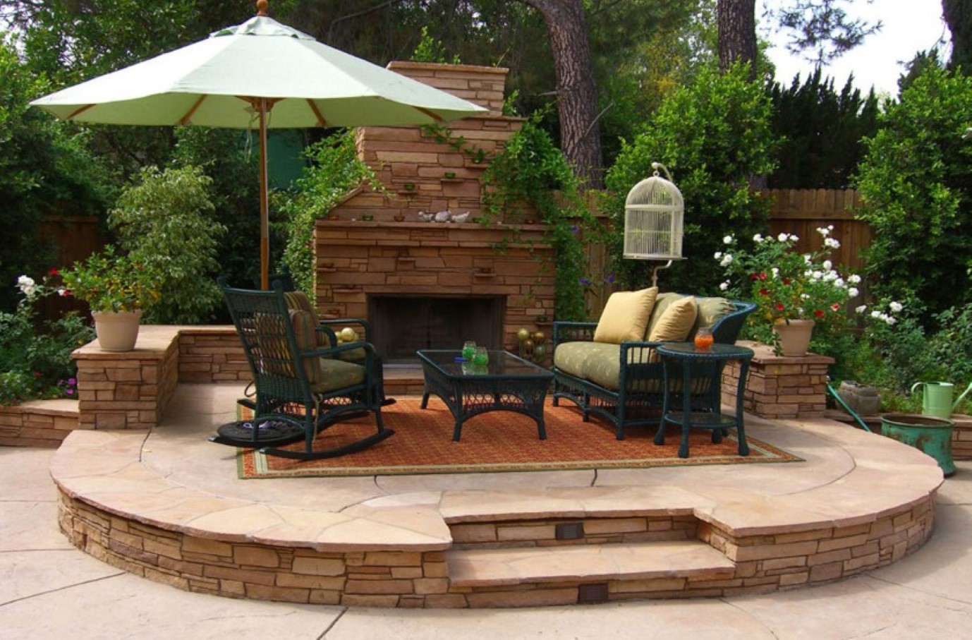 Brick Outdoor Brown Chic Brick Outdoor Fireplace Feat Brown Area Rug And Wicker Rocking Chair Plus Green Umbrella In Stunning Backyard Patio Idea Backyard  Decorating Backyard Patio Ideas For Lovely Family And Enhancing Your House Design 
