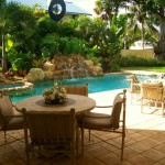Tropical Pool Dining Chic Tropical Pool And Round Dining Table Design Feat Brown Foamy Chairs In Attractive Backyard Patio Idea Backyard  Decorating Backyard Patio Ideas For Lovely Family And Enhancing Your House Design 