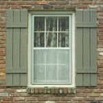 Grey Exterior And Classic Grey Exterior Window Shutters And White Framed Windows On Exterior Brick Wall Exterior Exterior Window Shutters With Maximum Functional Features