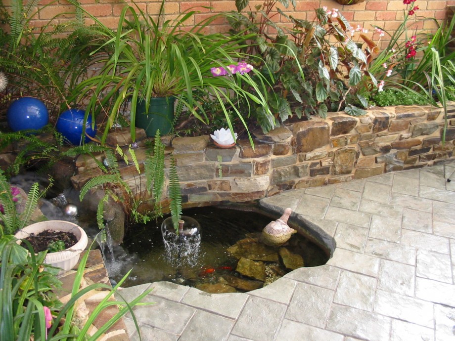 Flower Pots Small Colorful Flower Pots And Sophisticated Small Pond With Waterfall Plus Fake Turtle Decor Feat Beautiful Paving Floor Wonderful Garden Pond Ideas With Koi Fish
