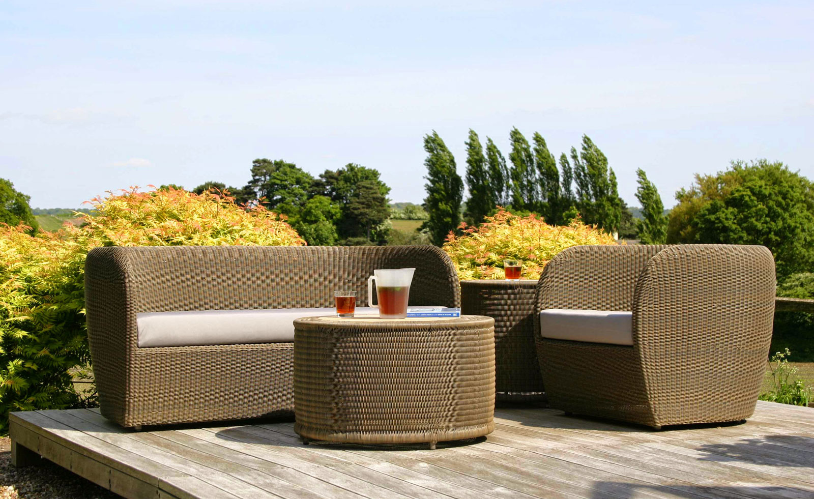 Outdoor Furniture Wicker Contemporary Outdoor Furniture Design With Wicker Sofa And Round Coffee Table Decorated With Wooden Deck Flooring Furniture Contemporary Outdoor Furniture As A Companion To Nature