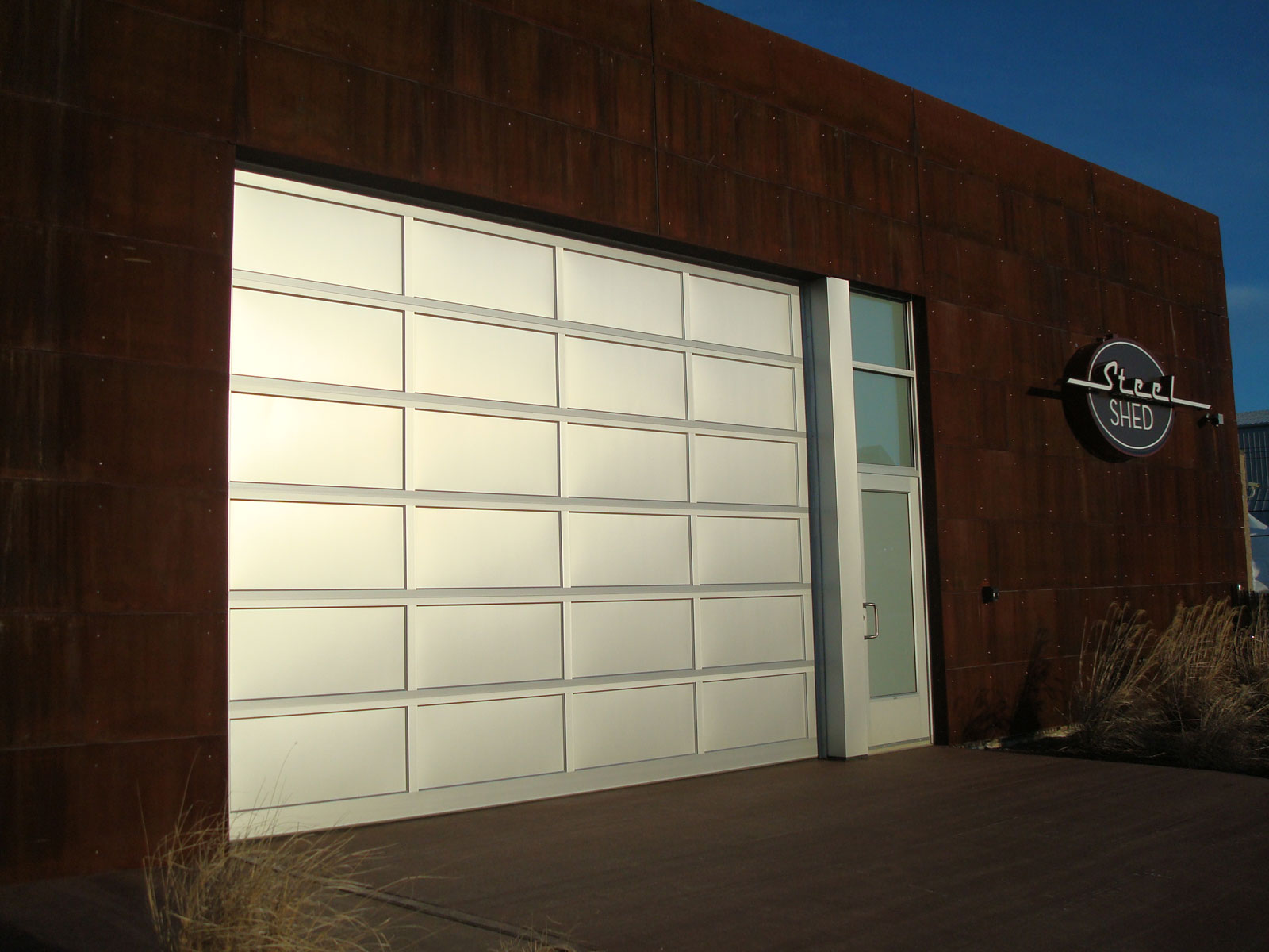 Modern Garage With Cool Modern Garage Doors Design With White Color Made From Wooden Material In Brown Brick Wall Decoration Decoration Fascinating Modern Garage Doors Used In Remarkable Designs