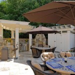 Statue Decor Outdoor Crane Statue Decor Feats Stunning Outdoor Kitchen With Dining Area Idea Plus Beautiful White Pergola And Stone Fireplace Outdoor Kitchen Design For A Wonderful Patio