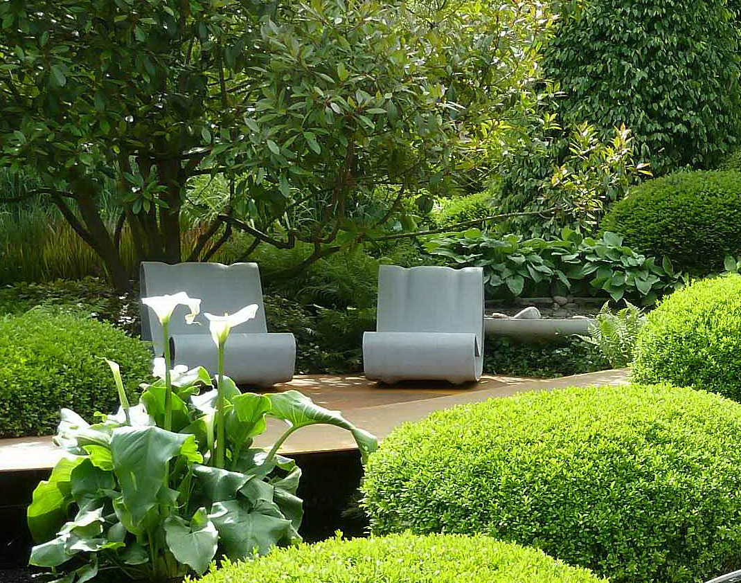 Modern Lanscape With Dazzling Modern Landscape Design Ideas With Furnished With Green Plants And Completed With Elegant Chairs In White Color Under The Tree Exterior Landscape Design Ideas With Natural Decoration