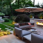 Patio In Design Dazzling Patio In Backyard Landscape Design With Electric Fireplace Furnished With Grey Sofa Also Chairs And Table Plus Completed With Umbrella Decoration Backyard Landscape Design: Decorating The Space