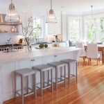 White Kitchen Wood Dazzling White Kitchen With Sleek Wood Laminate Flooring Tile With Kitchen Island Furnished With Sink And High Chairs And Completed With Double Pendant Lamps Interior Design Wood Laminate Flooring Design In Home Interior