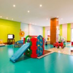 Playroom Of Rooms Enchanting Playroom Of Kids Chat Rooms Applying Green Accent Wall Color Combined With Cyan Flooring Color Furnished With Slide And Sofa Completed By Colorful Cushions Kids Room Design And Furniture Of Kids Chat Rooms