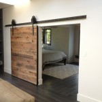 Rustic Bedroom Wooden Excellent Rustic Bedroom Applying Black Wooden Flooring With Sliding Interior Wood Doors Completed With Bed And Night Lamp Also Furnished With Thick Rug Interior Design The Possible Combination Of The Interior Wood Doors