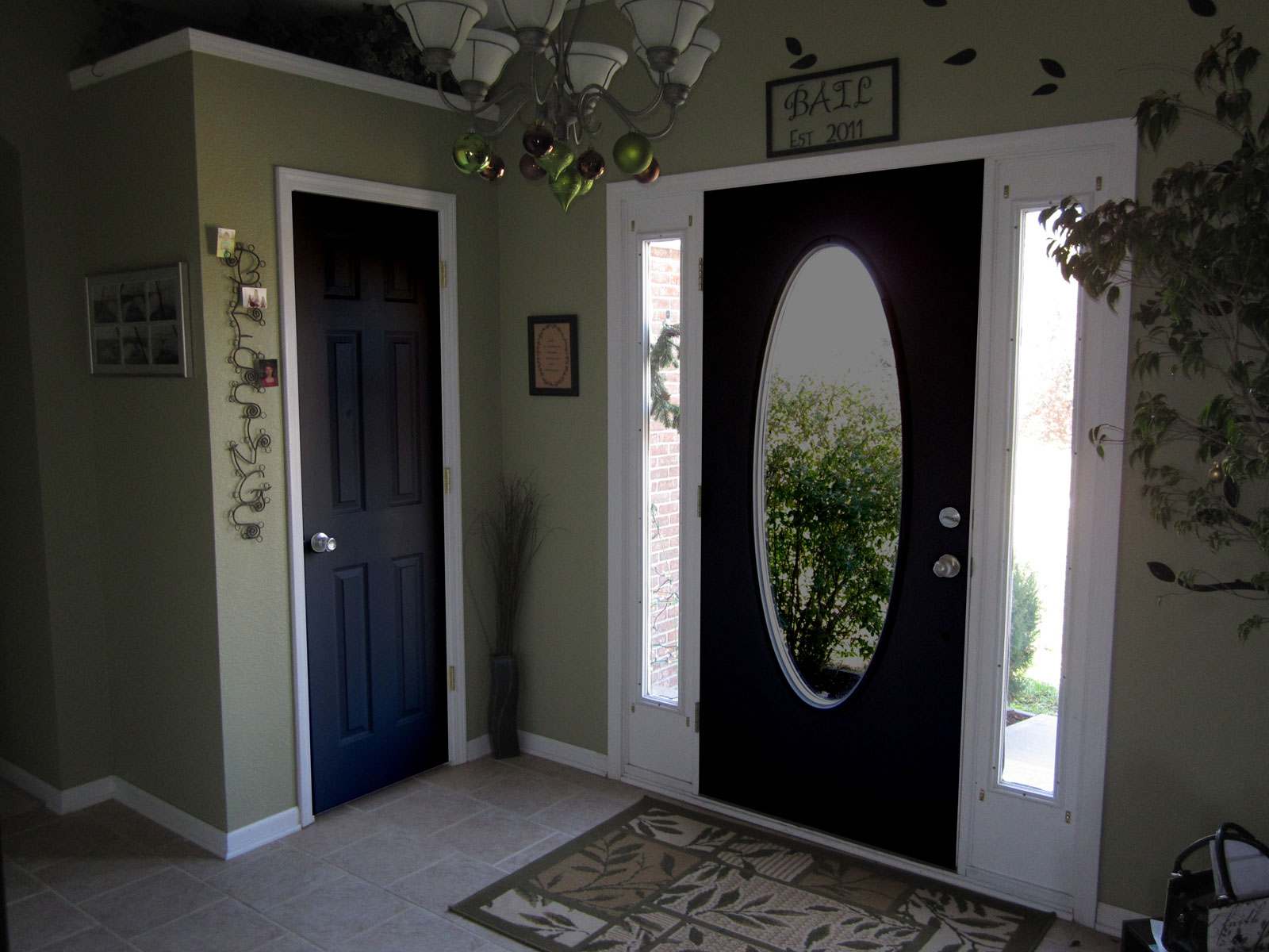Black Interior Clear Exciting Black Interior Doors And Clear Glass Screen In Entrance Completed With Rug And Wall Decorations Also Furnished With Antique Chandelier Interior Design Black Interior Doors And Its Elegant Appearance