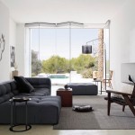 Modern Family Glass Exciting Modern Family Room Applying Glass Modern Interior Doors Completed With Black Sectional Sofa Bed In Tufted Design Also Furnished With Chair And Table On Grey Rug Interior Design Modern Interior Doors: Between The Wooden And The Glass One