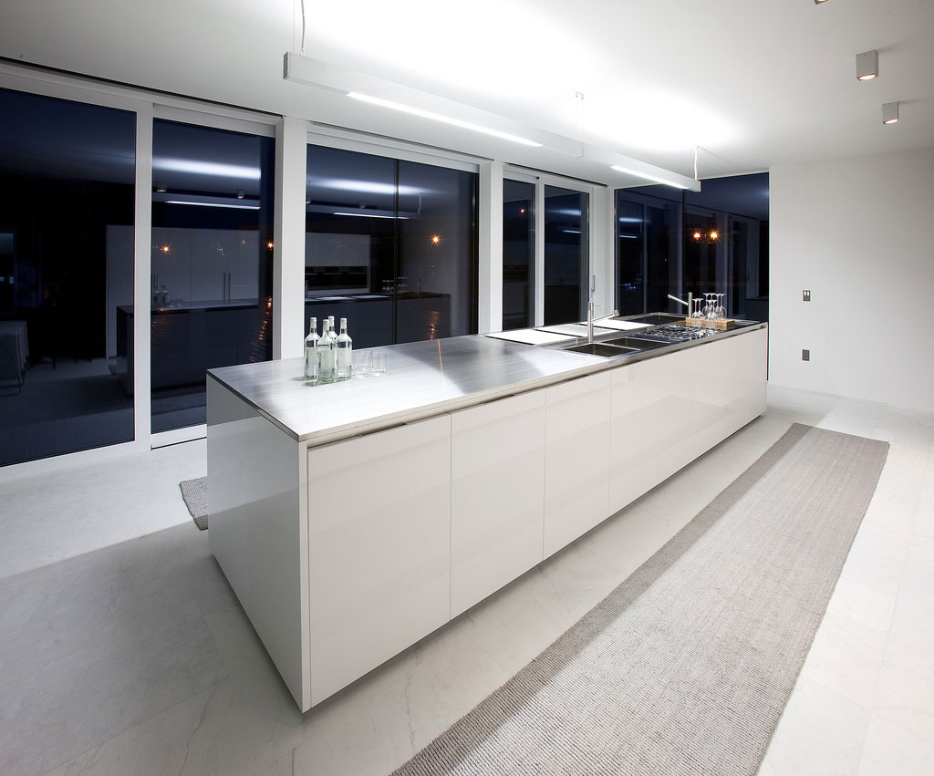 White Kitchen Black Exciting White Kitchen Interior Applying Black Glass Side Wall Furnished With Modern Kitchen Cabinets Completed By Double Basin Sink And Range Kitchen Modern Kitchen Cabinets Design Inspiration