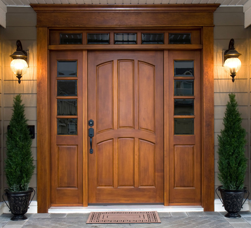 Dark Brown Ideas Extraordinary Dark Brown Front Door Ideas Wooden Made With Glass Screens On Side Furnished With Wall Lanterns Completed With Doormat And Green Plants As Decor Exterior Front Door Ideas: The “Face” Of The House