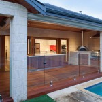 Decking Floor Pool Fancy Decking Floor And Glass Pool Fence Feat Ultra Modern Outdoor Kitchen With Island Table Idea Kitchen Outdoor Kitchen Design For A Wonderful Patio