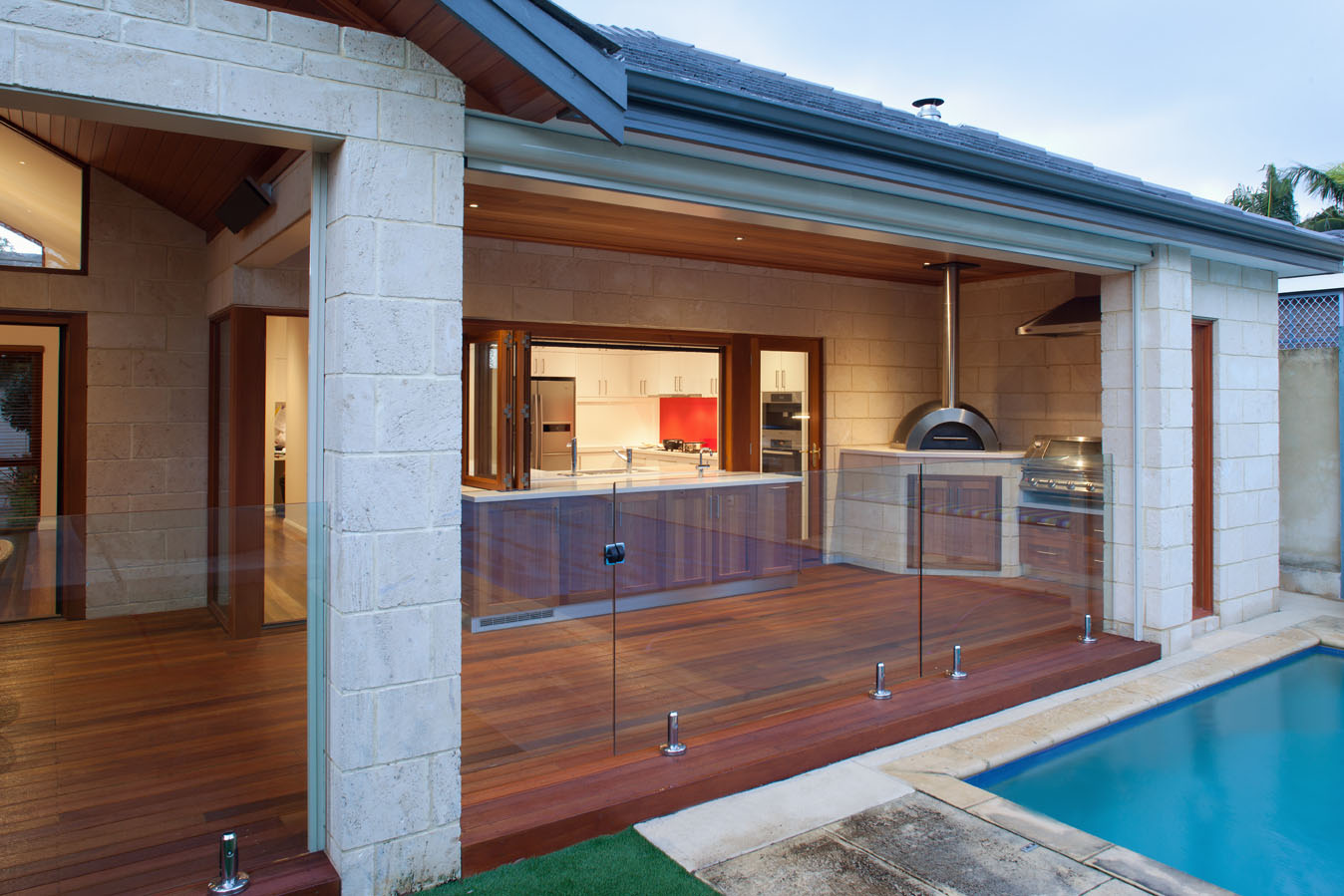 Decking Floor Pool Fancy Decking Floor And Glass Pool Fence Feat Ultra Modern Outdoor Kitchen With Island Table Idea Kitchen Outdoor Kitchen Design For A Wonderful Patio