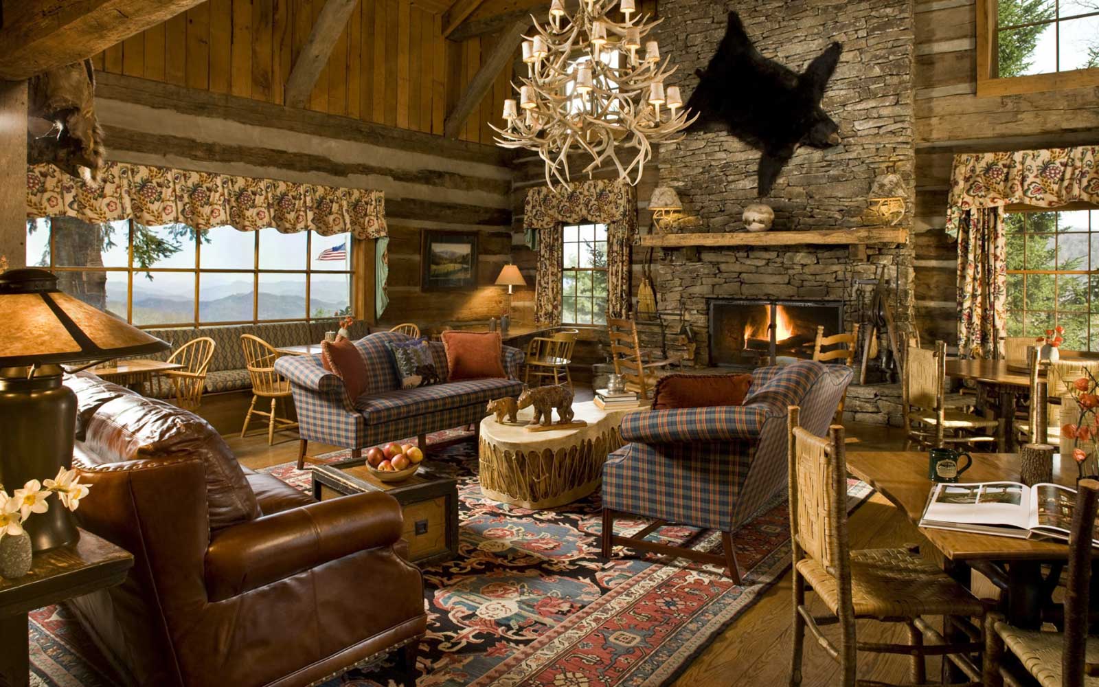 Rustic Living With Fascinating Rustic Living Room Decor With Double Sofa And Wooden Table Furnished With Horn Chandelier Design And Completed With Fireplace Living Room Beautifying Living Room Decor Through The Right Room Spots