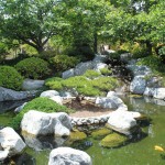 White Stone Awesome Large White Stone Decoration And Awesome Garden Pond Surrounded By Rich Trees Also Topiary Idea Decoration Wonderful Garden Pond Ideas With Koi Fish