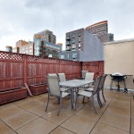 Island City Modern Long Island City Apartment Featured Modern Outdoor Dining Area And Freestanding Grill Plus Beautiful Wooden Fence Also Water Feature Decor Idea Apartment Compact Long Island City Apartment Interior Design In Open Plan Layout