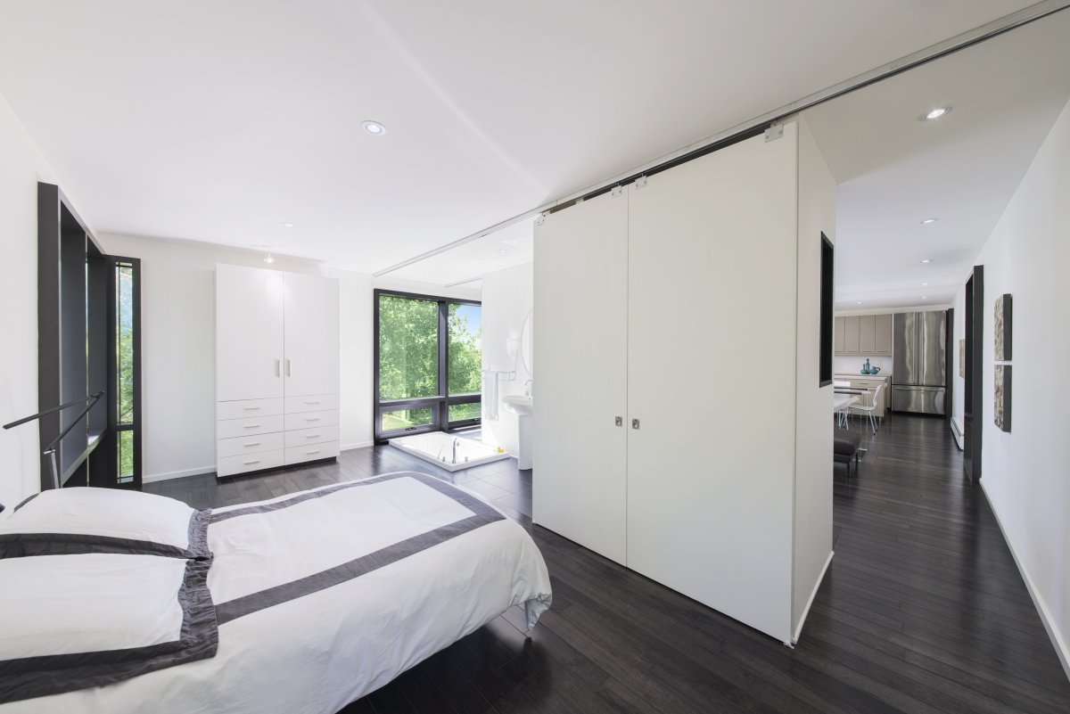 Bedroom Modern Design Master Bedroom Modern Hill House Design With Black And White Interior Color Decorating Ideas Dark Hardwood Floor Tiles Cupboard As Room Divider Plus Bathtub In The Corner Architecture Stylish Contemporary Home With A Concrete Brick Facade