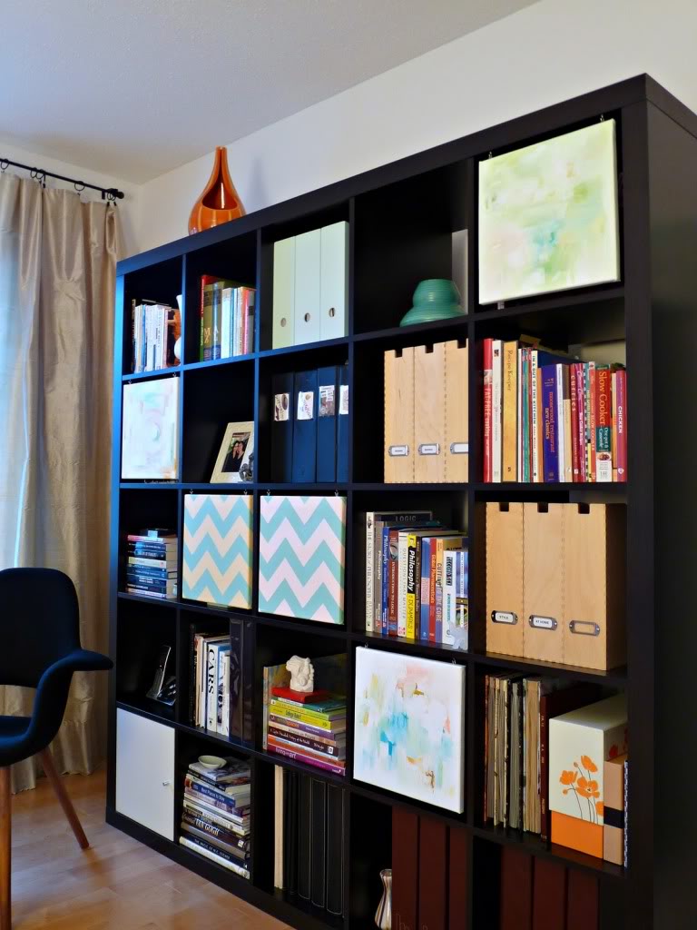 Design For Decorating Minimalist Design For Dark Bookshelf Decorating Ideas With Colorful Books And Files Beside Black Chair Decoration Bookshelf Decorating Ideas Complementing Your Minimalist Seating Room