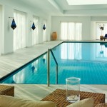 Minimalist Indoor Design Modern Minimalist Indoor Swimming Pool Design Decorated With Stylish Concrete Floor Edging Completed With Brown Sofa Indoor Swimming Pool Covered In Awesomeness