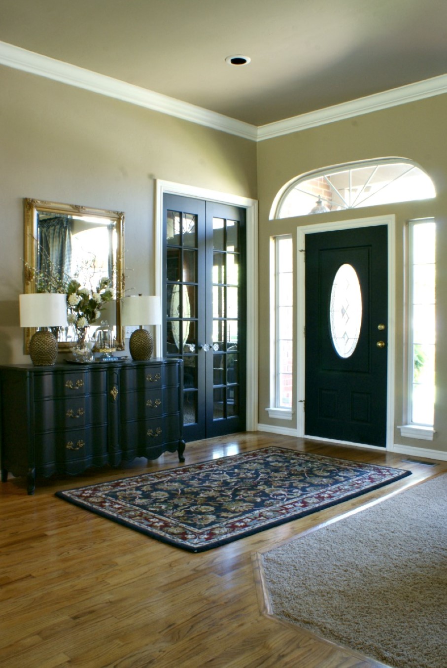Brown Foyer Color Neutral Brown Foyer Wall Paint Color Background Paired With Black Side Board And Decorative Front Door Under Fanlight Design House Designs  Black Interior Doors Perform Cool Doors 
