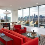 Sofa Idea Long Red Sofa Idea In Stunning Long Island City Apartment Interior Feat Modern Rocking Chair And Round Glass Coffee Table Compact Long Island City Apartment Interior Design In Open Plan Layout