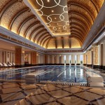 Curved Ceiling Oversized Remarkable Curved Ceiling Design Feat Oversized Pillars And White Lounge Chairs Plus Luxurious Indoor Swimming Pool With Diving Boards Pool  Modern Home Design With Indoor Swimming Pool 