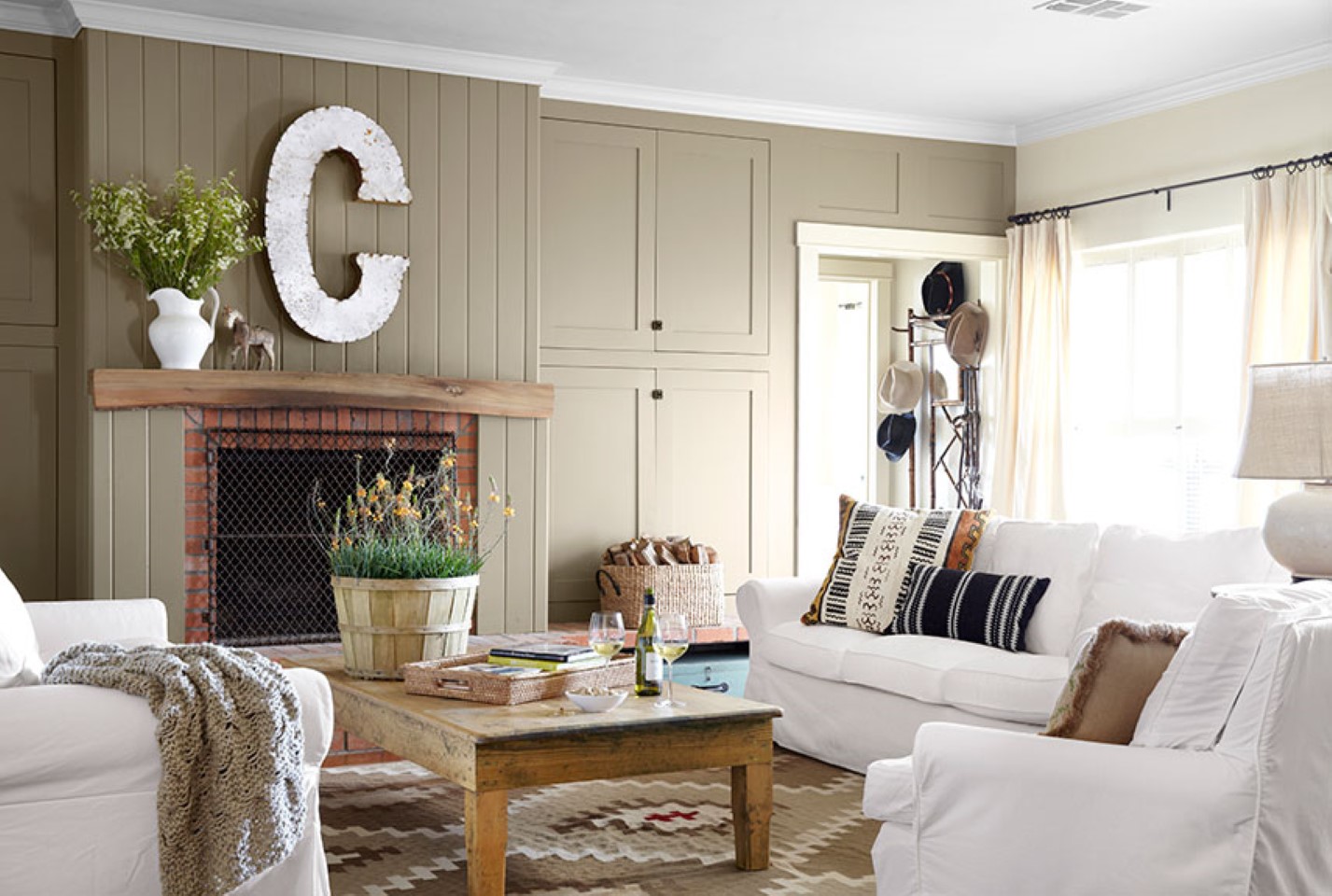 Country Living C Rustic Country Living Room With C Letter Display And White Sofa Slipcover Idea Feat Creative Brick Fireplace Mantel Living Room  Country Living Room Appears Appealing Interior 