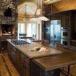 Kitchen Present With Rustic Kitchen Present Large Island With Cook Top Idea And Rock Fireplace Design Also Pretty Track Lights Feat Black Cabinets Kitchen  Awesome Designs From Rustic Kitchen Ideas 