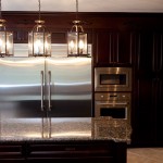 Steel Refrierator Brown Shiny Steel Refrigerator Tying On Brown Cabinets Near Cage Lamp As Kitchen Island Lighting Design Kitchen Kitchen Island Lighting System With Pendant And Chandelier