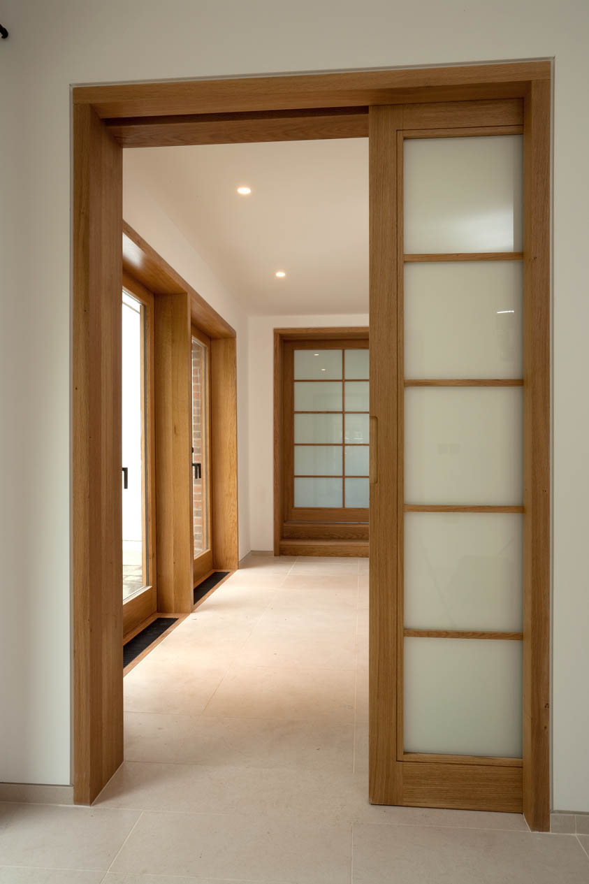 Wooden Frame Sliding Simple Wooden Frame For Wide Sliding Interior Doors In Minimalist House Hallway With White Wall Interior Design Sliding Interior Doors Completing Modern Interior With Movable Elements