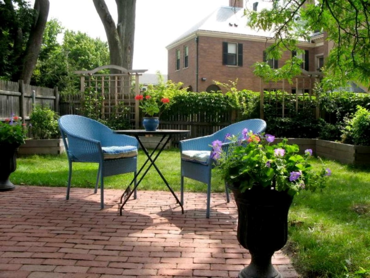 Backyard Idea Grasses Small Backyard Idea With Lush Grasses And Brick Paving Design Feat Pretty Blue Wicker Chairs Plus Black Urn  Garden  Stealing Garden Look With Small Backyard Ideas 