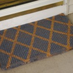 Front Door In Small Front Door Mats Design In Grey Color Combined With Gold Accent Color Made From Burlap Material For Inspiration Decoration Small Front Door Mats With Minimalist Decorations