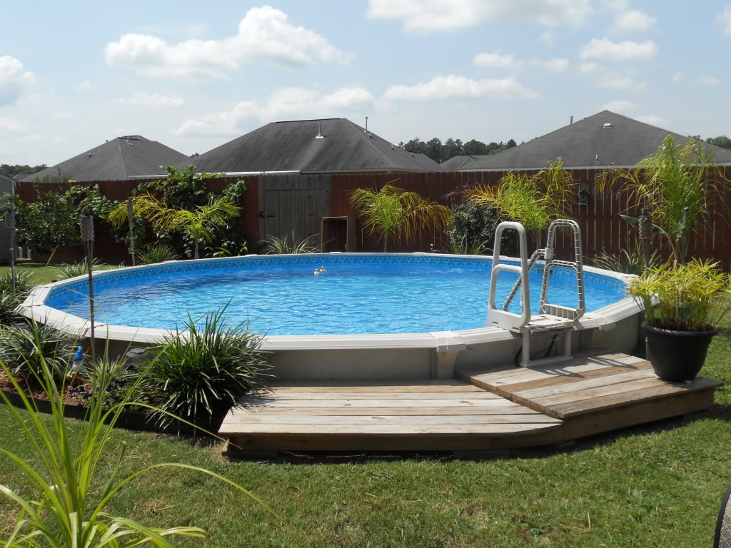 Pool Designs Oval Small Pool Designs Ideas With Oval Shape Decorated With Wooden Deck And Green Landscaping Decor For Home Inspiration Pool Small Pool Design In Swimming Lovers