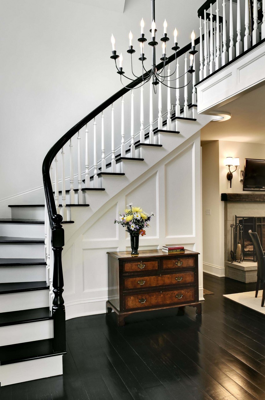 Wooden Side Under Small Wooden Side Board Put Under Curved Black And White Staircase Plus Decorative Wrought Iron Chandelier Decoration House Using Wrought Iron Chandeliers 