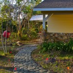Prefab Home Curvy Traditional Prefab Home Design With Curvy Pebble Stone Garden Path Ideas And Mini Red Flag Ornaments Garden Making A Wonderful Garden Path Ideas Using Stones
