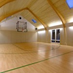 Indoor Basketball Vaulted Unusual Indoor Basketball Court With Vaulted Ceiling And Square Skylights Feat Laminate Floor Plus Portable Ball Racks Decoration  Fascinating Indoor Basketball Court Ideas 