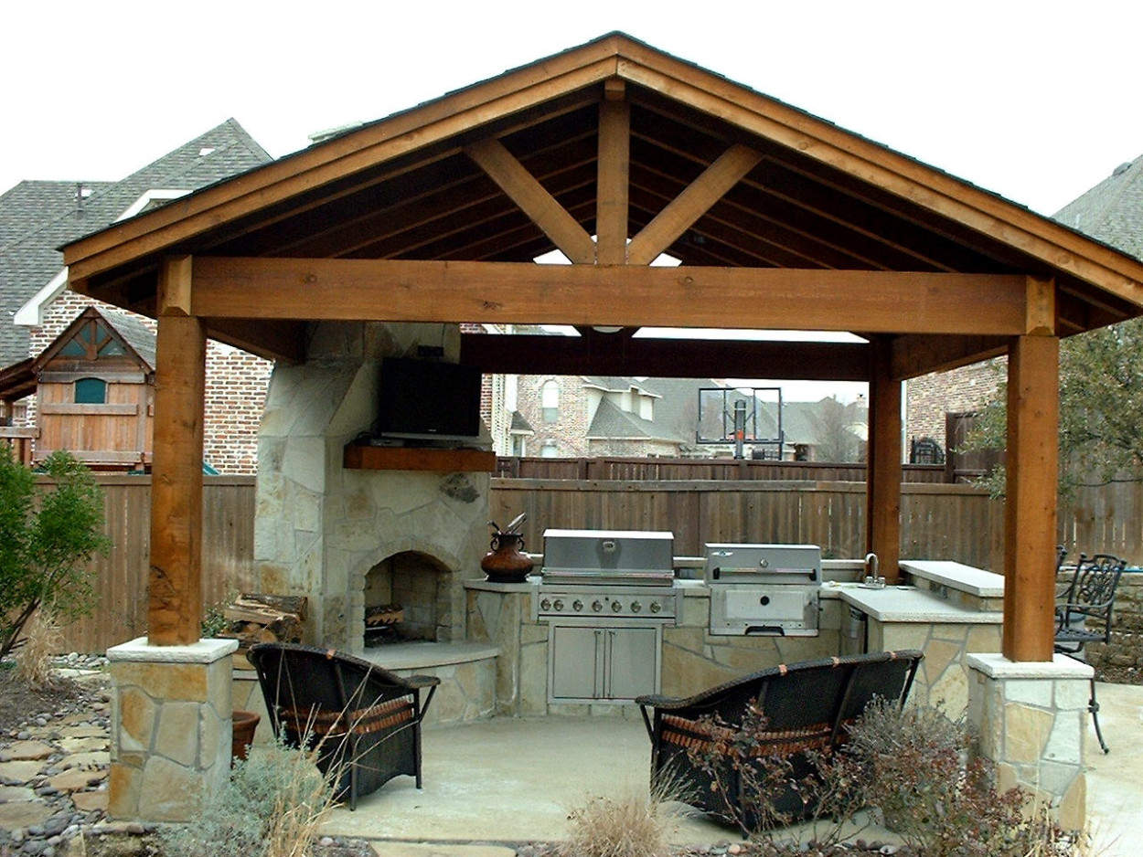 Wooden Gazebo Contemporary Vaulted Wooden Gazebo Design Feats Contemporary Outdoor Kitchen With Stone Fireplace Idea And Cozy Wicker Armchairs Kitchen Outdoor Kitchen Design For A Wonderful Patio