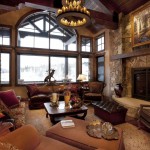 Of A Room View Of A Breathtaking Living Room For Rustic Living Room Ideas With Granite Floor Wooden Roof Ceilings Stone Walls Fireplace And Couches With Pillows Living Room Majestic Rustic Living Room With Delicate Beauty