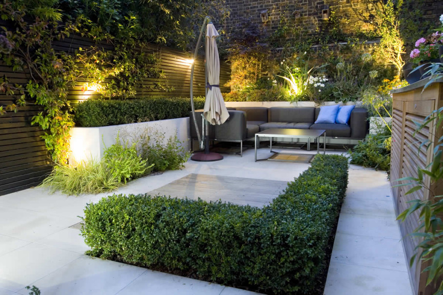 Of A Design View Of A Small Garden Design With White Granite Floor Couches With Pillows Shrubs And Other Plants Garden Inspiring Small Garden Design With Modern Furniture