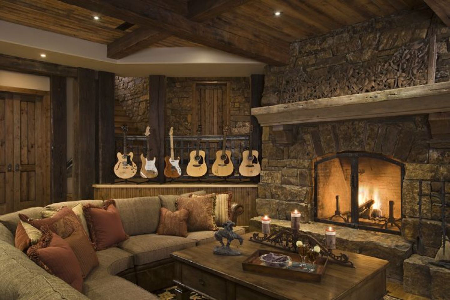 Of A Living View Of A Sophisticated Rustic Living Room With Wooden Coffee Table Stone Walls Couches With Pillows And Guitar Shelves Living Room Majestic Rustic Living Room With Delicate Beauty