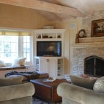 Wall And In Stone Wall And Dark Fireplace In The Living Room With White Tv Cabinet And Cozy Bench Living Room  Adorable TV Cabinet To Keep Your TV In Living Room 