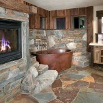 Fireplace And In Wide Fireplace And Stone Wall In Ski Slope High Camp Home Bathroom With Brown Tub And Stone Floor House Designs  Mountain Home Design: The Ski Slope 