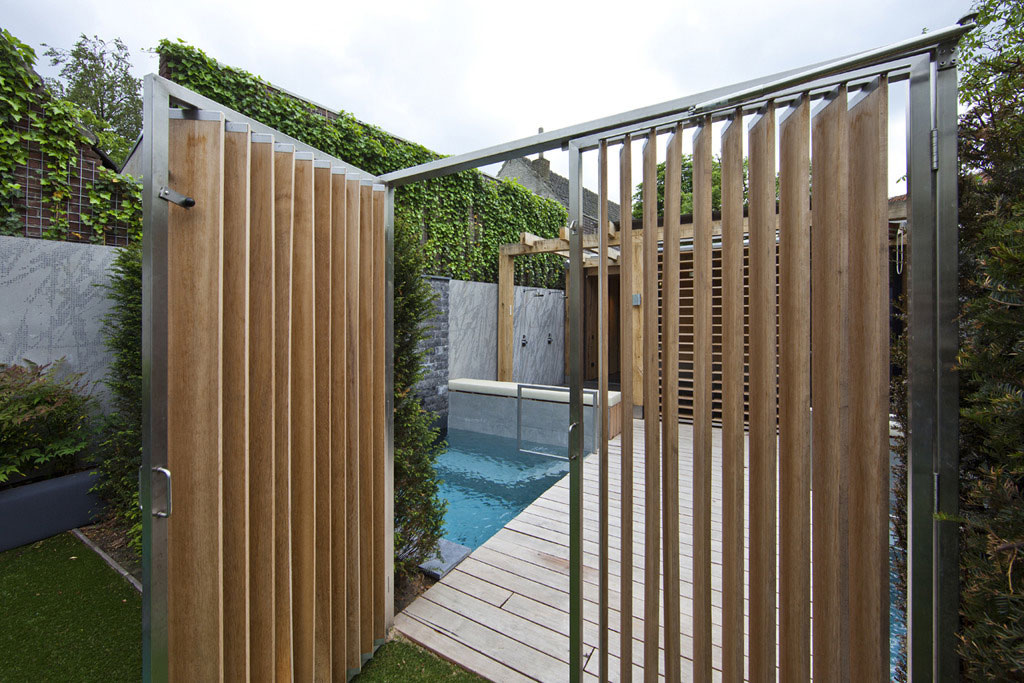 Vertical Wooden With Innovative Vertical Wooden Fence Combined With Metal Trim Design Idea Feat Small Backyard Pool And Climbing Plant Garden  Outdoor  Bringing Natural Texture With Wood Fence Design 