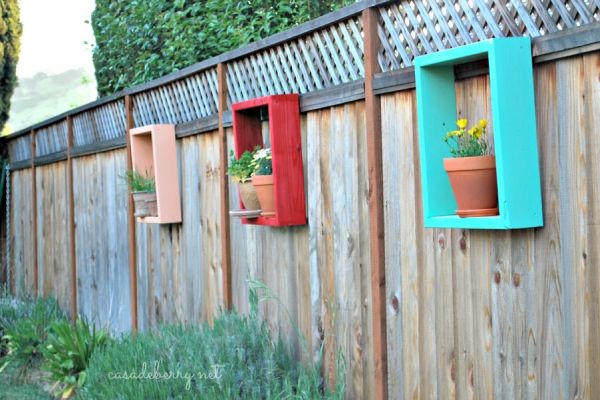 Framed Flowers And Appealing Framed Flowers With Red And Blue Color On Rustic Plank Fence Outside The House With Green Grass Outdoor Beautiful Backyard Ideas Prettifying Your Outdoor Space